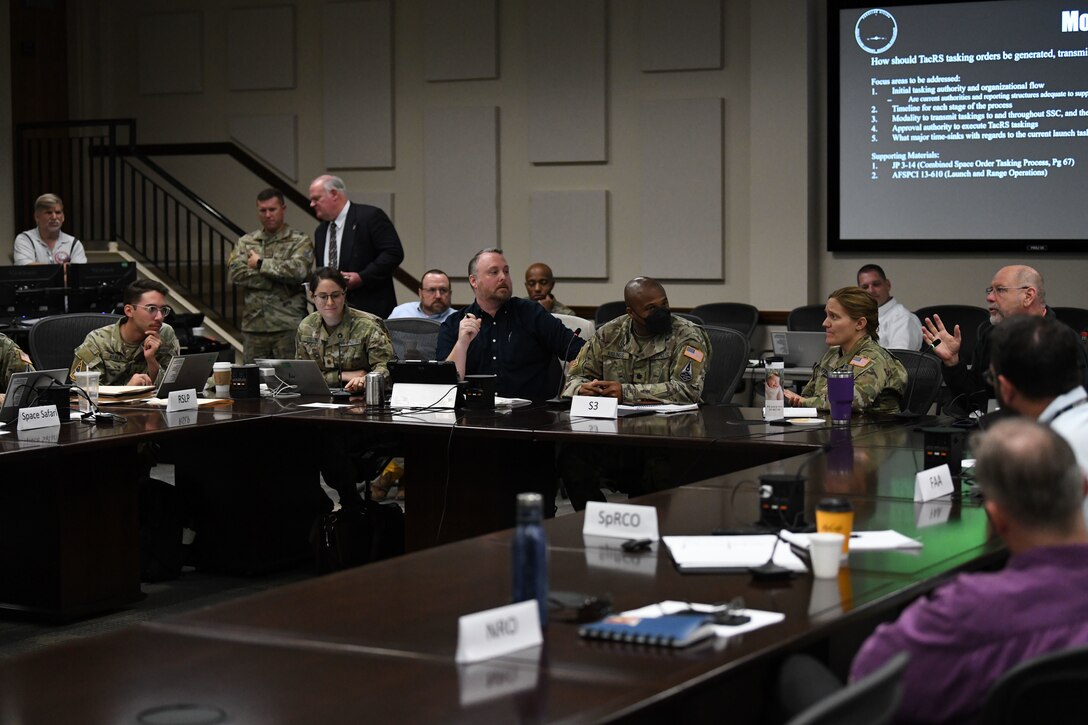 Interagency partners conversate during Space Systems Command’s first joint operations training, Sept. 8, 2022, at Cape Canaveral Space Force Station, Fla. For its inaugural scenario, this three-day exercise focused on streamlining interagency responsibilities to generate Tactically Responsive Space (TacRS) capabilities at a faster rate. (U.S. Space Force photo by Senior Airman Samuel Becker)