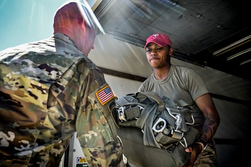 U.S. Army Soldiers assigned to the 404th Civil Affairs Battalion, prepare jump packs for an Airborne operation at Joint Base McGuire-Dix-Lakehurst, N.J. on 10 Sept. 2022. The unit conducted non-tactical airborne operations at the Army Aviation Facility in order to maintain mission readiness and proficiency among their paratroopers with the assistance of two CH-47’s out of Virginia.The Army Aviation Facility was created through a MILCON effort valued at 11.7 million dollars and made possible by the joint effort of ASA Fort Dix and the U.S. Marine Corps Marine Aircraft Group 49. The 2100 square foot building is host to an Army Ramp Management Area which provides a wide range of capabilities for both fixed and rotary wing aircraft such as the C-130, CH-47S, and UH-60S.