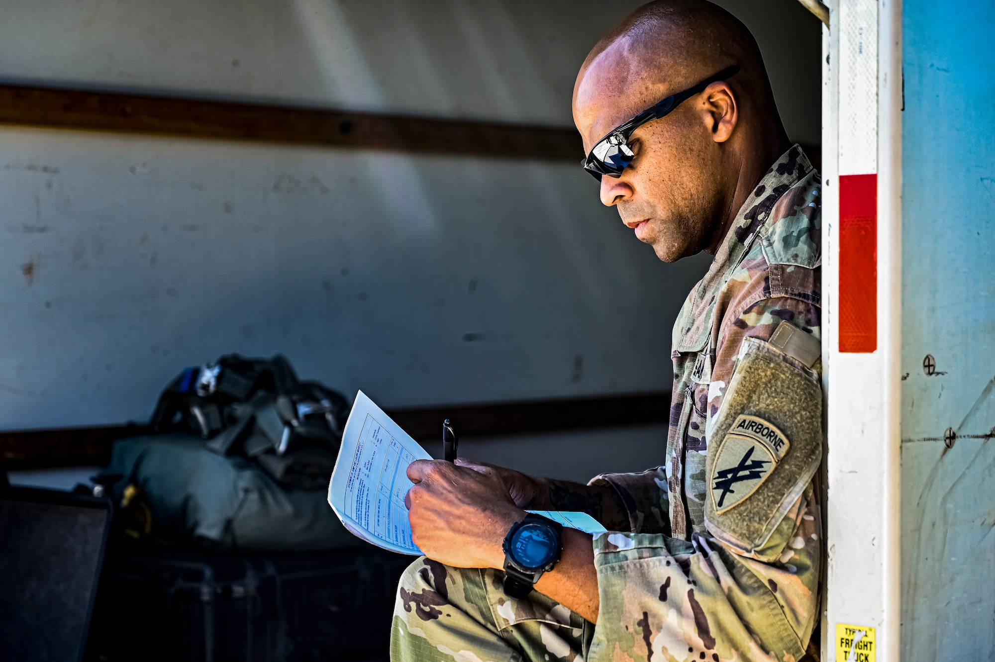 A U.S. Army Soldier assigned to the 404th Civil Affairs Battalion, prepares jump packs for an Airborne operation at Joint Base McGuire-Dix-Lakehurst, N.J. on Sept. 10, 2022. The unit conducted non-tactical airborne operations at the Army Aviation Facility in order to maintain mission readiness and proficiency among their paratroopers with the assistance of two CH-47’s out of Virginia.The Army Aviation Facility was created through a MILCON effort valued at 11.7 million dollars and made possible by the joint effort of ASA Fort Dix and the U.S. Marine Corps Marine Aircraft Group 49. The 2100 square foot building is host to an Army Ramp Management Area which provides a wide range of capabilities for both fixed and rotary wing aircraft such as the C-130, CH-47S, and UH-60S.