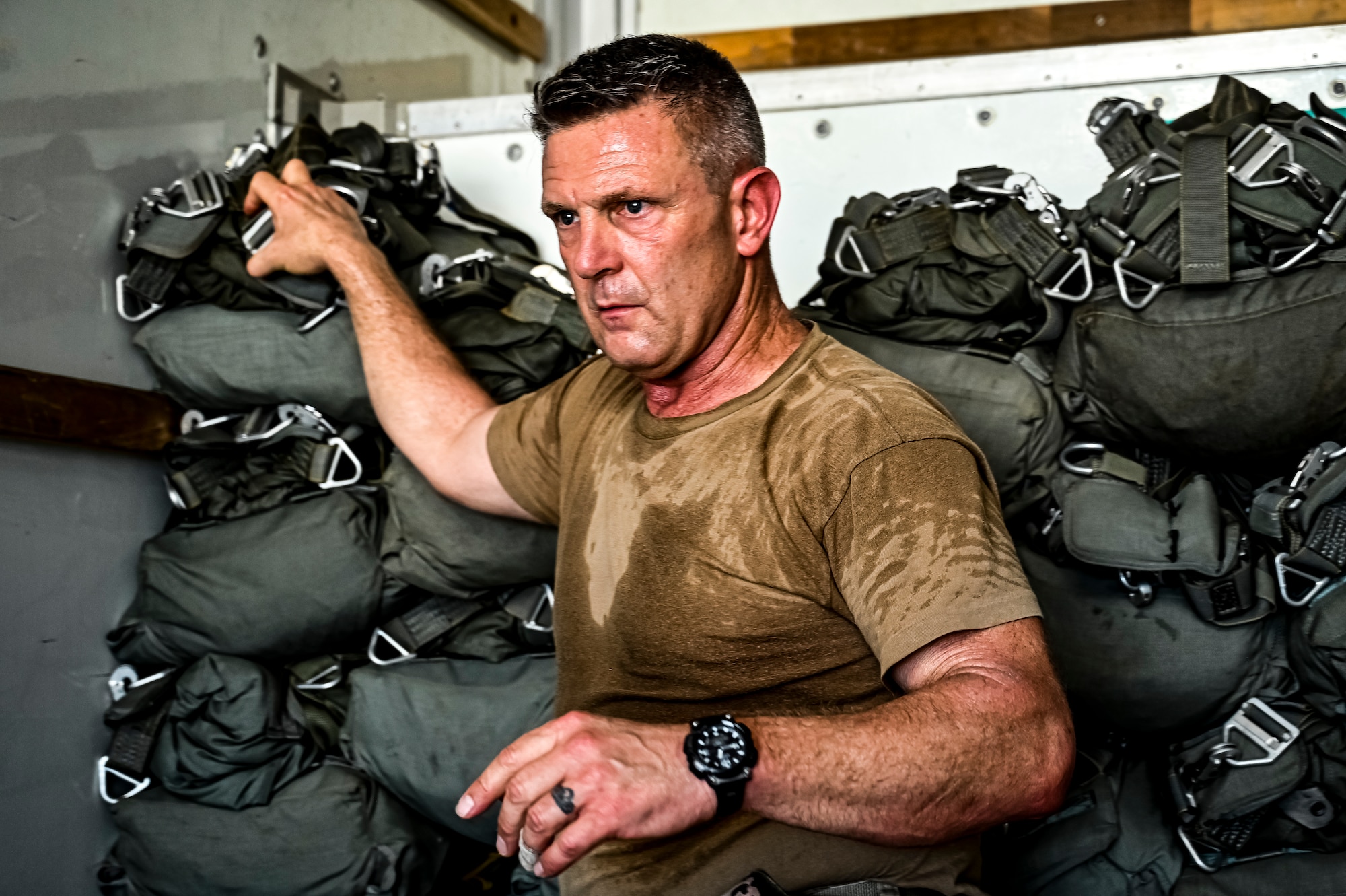 A U.S. Army Soldier assigned to the 404th Civil Affairs Battalion, prepares jump packs for an Airborne operation at Joint Base McGuire-Dix-Lakehurst, N.J. on Sept. 10, 2022. The unit conducted non-tactical airborne operations at the Army Aviation Facility in order to maintain mission readiness and proficiency among their paratroopers with the assistance of two CH-47’s out of Virginia.The Army Aviation Facility was created through a MILCON effort valued at 11.7 million dollars and made possible by the joint effort of ASA Fort Dix and the U.S. Marine Corps Marine Aircraft Group 49. The 2100 square foot building is host to an Army Ramp Management Area which provides a wide range of capabilities for both fixed and rotary wing aircraft such as the C-130, CH-47S, and UH-60S.