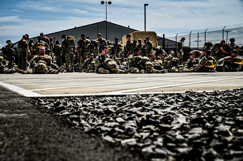 U.S. Army Soldiers assigned to the 404th Civil Affairs Battalion, prepare jump packs for an Airborne operation at Joint Base McGuire-Dix-Lakehurst, N.J. on Sept. 10, 2022. The unit conducted non-tactical airborne operations at the Army Aviation Facility in order to maintain mission readiness and proficiency among their paratroopers with the assistance of two CH-47’s out of Virginia.The Army Aviation Facility was created through a MILCON effort valued at 11.7 million dollars and made possible by the joint effort of ASA Fort Dix and the U.S. Marine Corps Marine Aircraft Group 49. The 2100 square foot building is host to an Army Ramp Management Area which provides a wide range of capabilities for both fixed and rotary wing aircraft such as the C-130, CH-47S, and UH-60S.