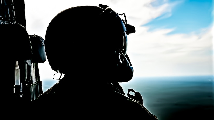 A U.S. Army Soldier assigned to the 404th Civil Affairs Battalion, surveys the landscape from CH-47 for an Airborne operation at Joint Base McGuire-Dix-Lakehurst, N.J. on Sept. 10, 2022. The unit conducted non-tactical airborne operations at the Army Aviation Facility in order to maintain mission readiness and proficiency among their paratroopers with the assistance of two CH-47’s out of Virginia.The Army Aviation Facility was created through a MILCON effort valued at 11.7 million dollars and made possible by the joint effort of ASA Fort Dix and the U.S. Marine Corps Marine Aircraft Group 49. The 2100 square foot building is host to an Army Ramp Management Area which provides a wide range of capabilities for both fixed and rotary wing aircraft such as the C-130, CH-47S, and UH-60S.