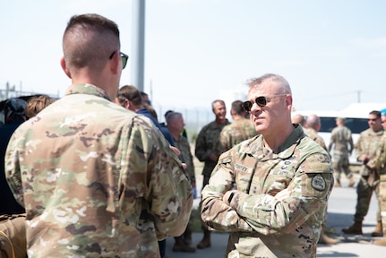 U.S. Army Maj. Gen. Michael J. Turley, the adjutant general commanding, Utah National Guard, visits with Guard members from the 151st Air Refueling Wing on Sept. 8, 2022, at Dugway Proving Ground, Utah.