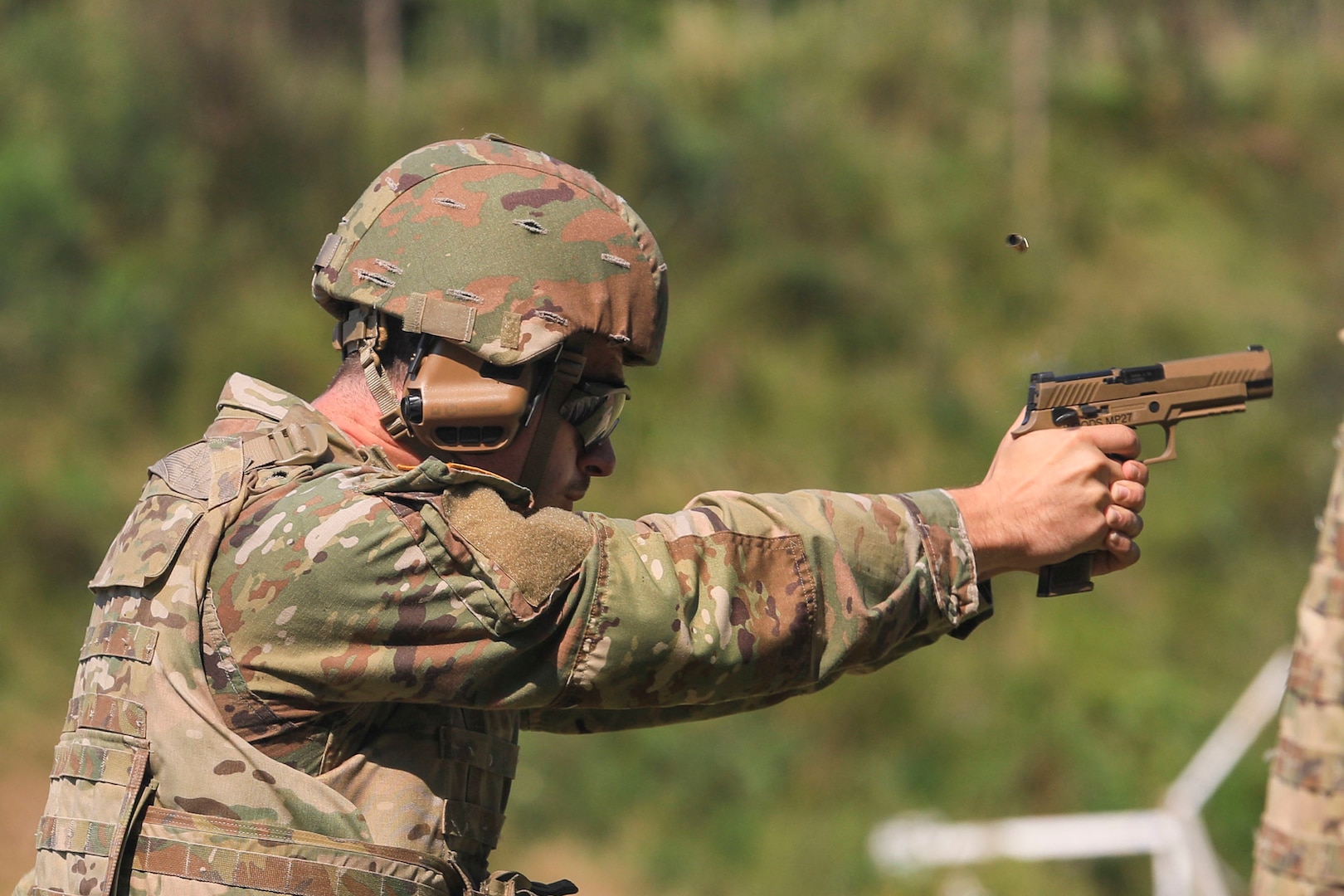 A vermont Army National Guard Soldier fire his M-17 during the individual pistol competition at the Vermont Adjutant General's 2022 Combat Marksmanship Competition held at the Ethan Allen Firing Range September 10-11, in Jericho Vermont.  (U.S. Army National Guard photo by Sgt. 1st Class Jason Alvarez)