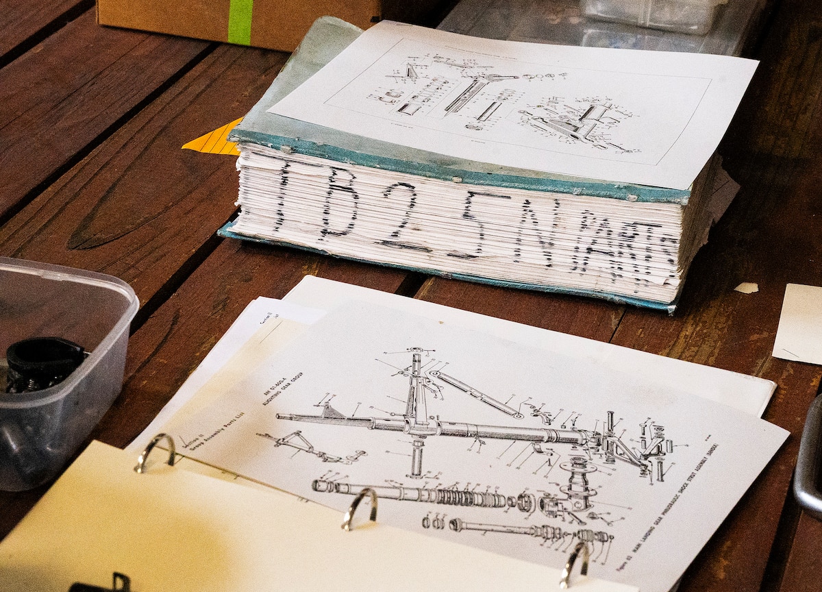 B-25 technical manuals sit on a workbench at the Champaign Aviation Museum on March 12, 2022, in Urbana, Ohio. Old manuals are referred to for maintenance on the old plane. (U.S. Air Force photo by R.J. Oriez)