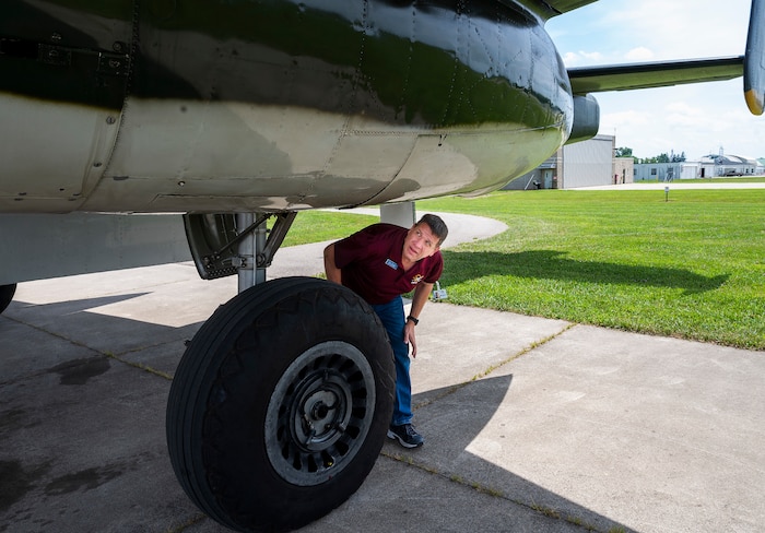 Chuck Mangold performs a preflight check on the Champaign Gal, a World War II B-25 bomber, on July 15, 2022, at Grimes Field in Urbana, Ohio. Mangold, among the Champaign Aviation Museum volunteer pilots, has a day job as a flight safety officer in one of the Air Force Life Cycle Management Center’s system program offices. He is a retired Air Force lieutenant colonel and C-130 pilot. (U.S. Air Force photo by R.J. Oriez)
