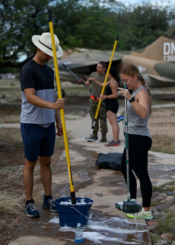 A photo of people with a bucket of soap.