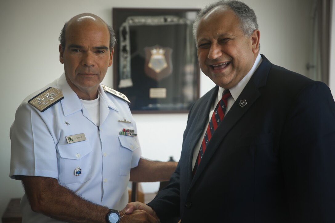 RIO DE JANEIRO (Sept. 8, 2022) Brazilian Navy Adm. Marcos Sampaio Olsen, Commander Naval Operations, and U.S. Secretary of the Navy Carlos Del Toro greet each other prior to the opening ceremony for UNITAS LXIII, Sept. 8, 2022. UNITAS is the world’s longest-running maritime exercise. Hosted this year by Brazil, it brings together multinational forces from Brazil, Cameroon, Chile, Colombia, Dominican Republic, Ecuador, France, Guyana, Jamaica, Mexico, Namibia, Panama, Paraguay, Peru, South Korea, Spain, United Kingdom, Uruguay, and the United States conducting operations in and off the coast of Rio de Janeiro. The exercise trains forces to conduct joint maritime operations through the execution of anti-surface, anti-submarine, anti-air, amphibious and electronic warfare operations that enhance warfighting proficiency and increase interoperability among participating naval and marine forces. (U.S. Marine Corps photo by Cpl. Ethan Craw/Released)