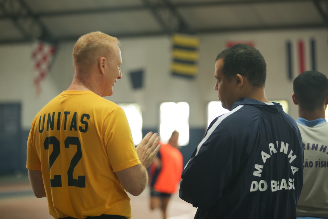 RIO DE JANEIRO (Sept. 12, 2022) U.S. Navy LCDR. William Alcorn talks with CDR. Julio Delfino, Brazilian Navy, during a community relations event during UNITAS LXIII, Sept. 12, 2022. UNITAS is the world’s longest-running maritime exercise. Hosted this year by Brazil, it brings together multinational forces from Belize, Brazil, Cameroon, Chile, Colombia, Dominican Republic, Ecuador, France, Guyana, Jamaica, Mexico, Namibia, Panama, Paraguay, Peru, South Korea, Spain, United Kingdom, Uruguay, and the United States conducting operations in and off the coast of Rio de Janeiro. The exercise trains forces to conduct joint maritime operations through the execution of anti-surface, anti-submarine, anti-air, amphibious and electronic warfare operations that enhance warfighting proficiency and increase interoperability among participating naval and marine forces. (U.S. Marine Corps photo by Cpl. Ethan Craw/Released)