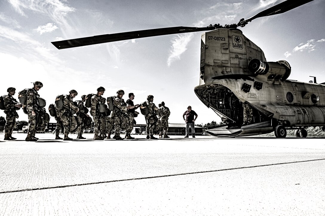 U.S. Army Soldiers assigned to the 404th Civil Affairs Battalion, board a CH-47 for an Airborne operation at Joint Base McGuire-Dix-Lakehurst, N.J. on Sept. 10, 2022. The unit conducted non-tactical airborne operations at the Army Aviation Facility in order to maintain mission readiness and proficiency among their paratroopers with the assistance of two CH-47’s out of Virginia.The Army Aviation Facility was created through a MILCON effort valued at 11.7 million dollars and made possible by the joint effort of ASA Fort Dix and the U.S. Marine Corps Marine Aircraft Group 49. The 2100 square foot building is host to an Army Ramp Management Area which provides a wide range of capabilities for both fixed and rotary wing aircraft such as the C-130, CH-47S, and UH-60S.