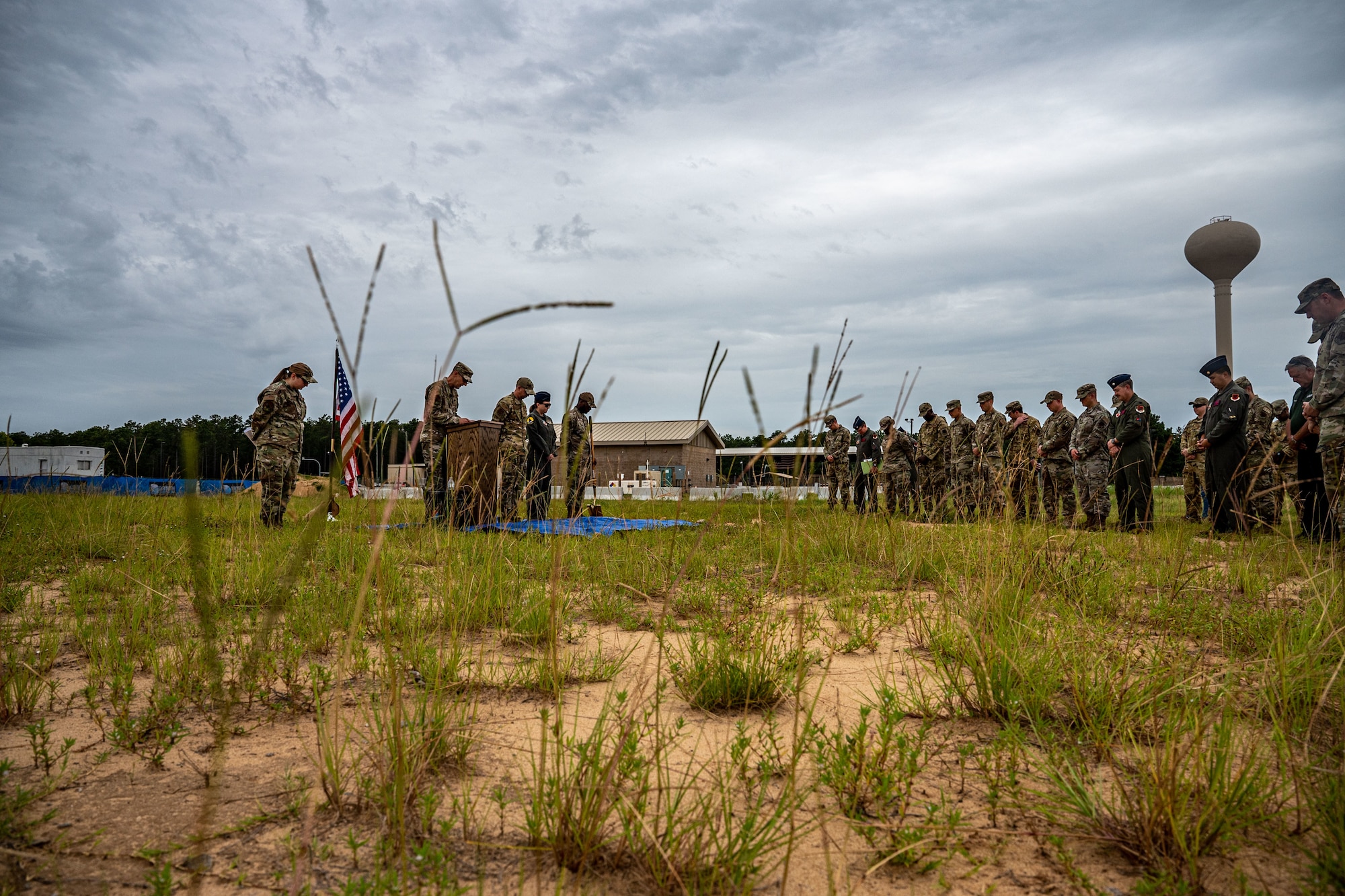 A photo of a group of Airmen outside during a groundbreaking ceremony