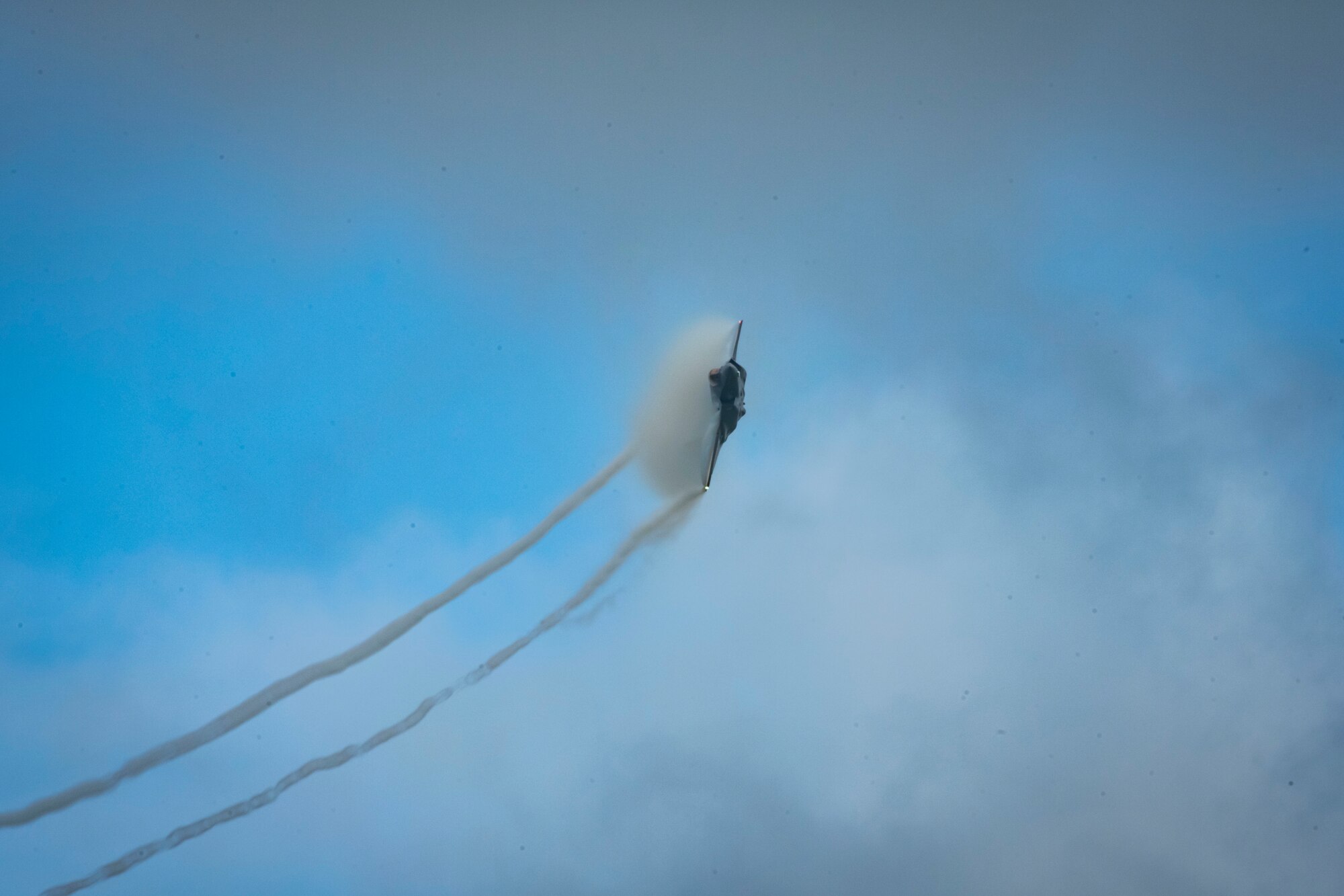 U.S. and Japanese military aircraft are displayed to attendees during an air show.