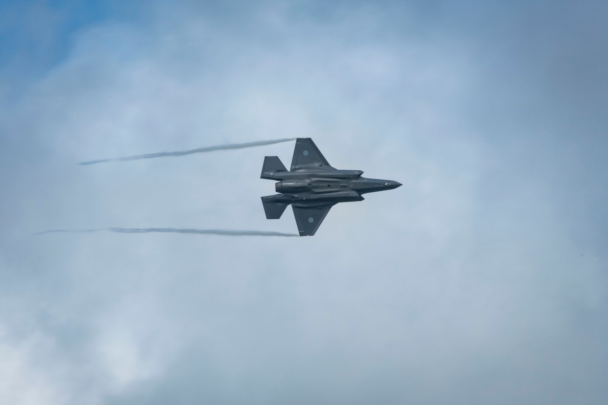 U.S. and Japanese military aircraft are displayed to attendees during an air show.