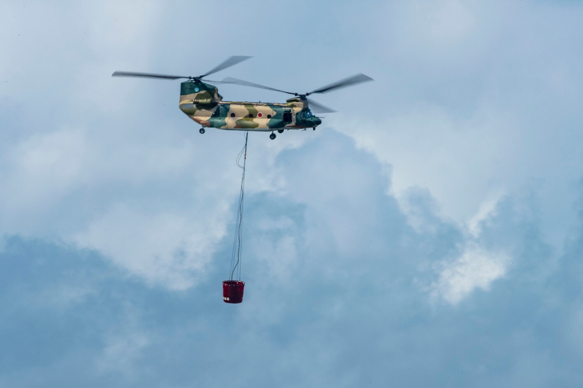 U.S. and Japanese military aircraft are displayed to attendees during an air show.