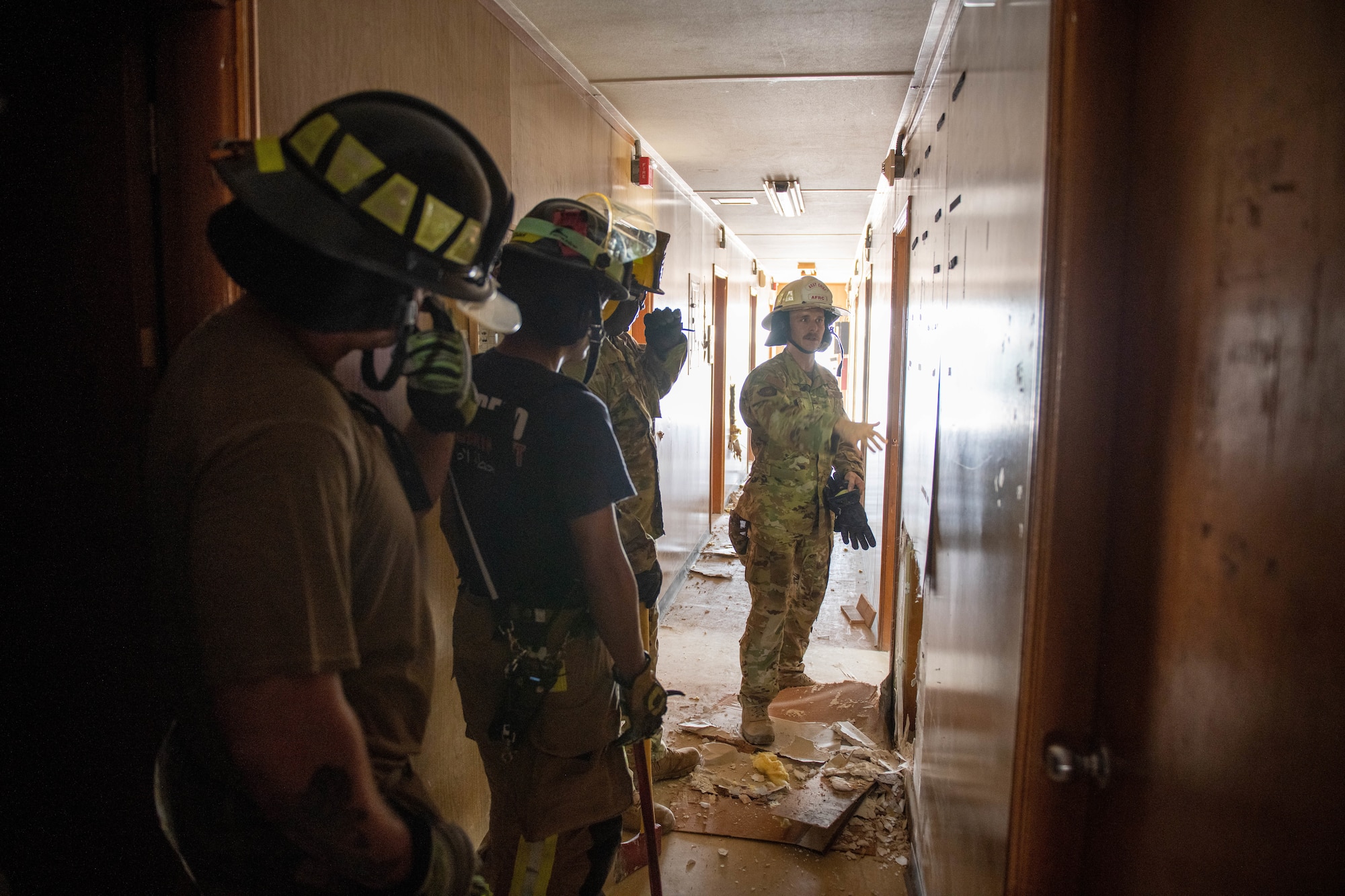 Firefighters with the 577th Expeditionary Prime Base Engineer Emergency Force Squadron Quick Strike Team work with firefighters from the 379th Expeditionary Civil Engineer Group during a forced entry exercise on Al Udeid Air Base, Qatar, Sept. 7, 2022. The QST provides rapid emergency response to the U.S. Air Forces Central area of responsibility. (U.S. Air National Guard photo by Airman 1st Class Constantine Bambakidis)