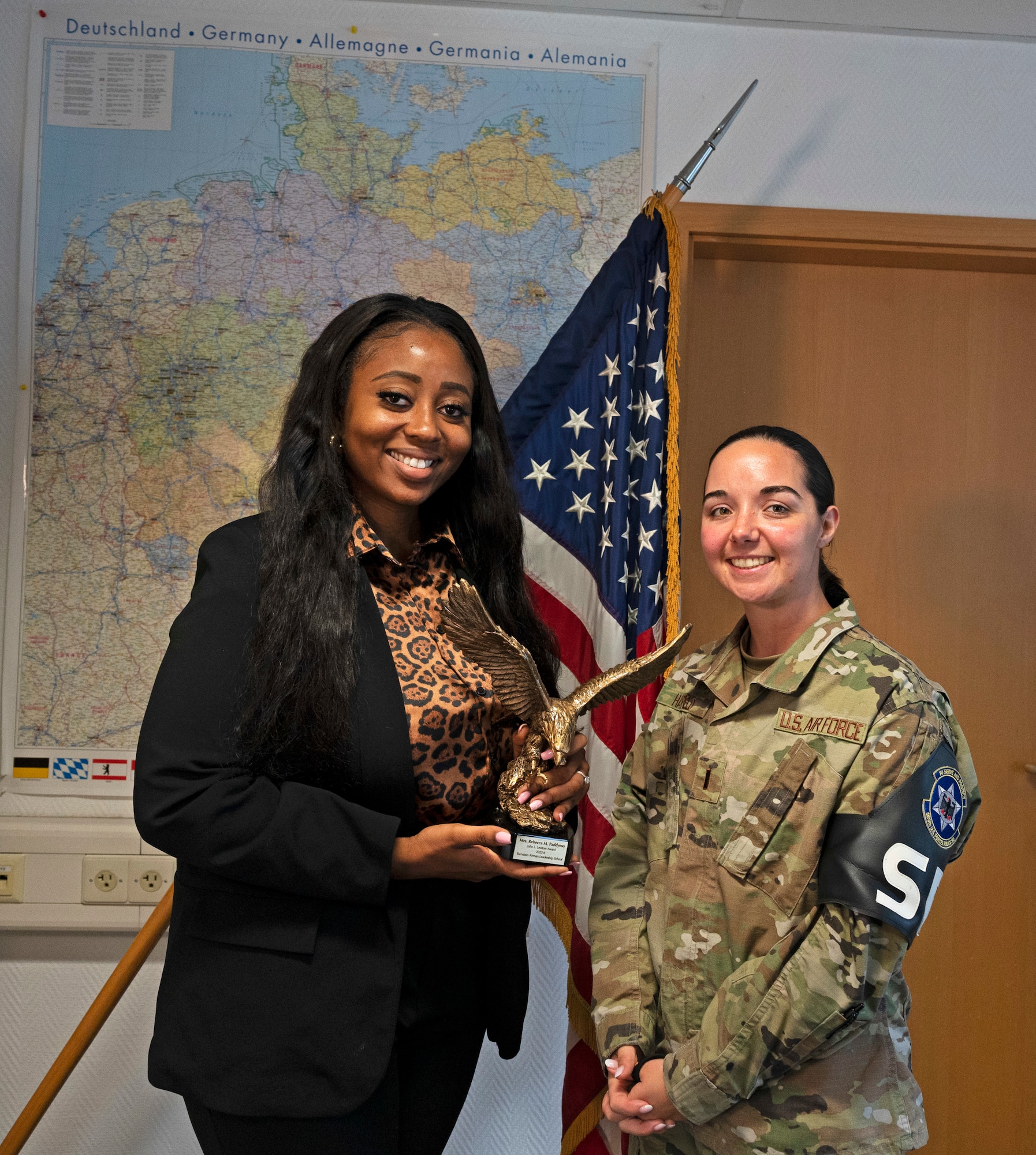 Rebecca Paddymo, left, 569th U.S. Forces Police Squadron program coordinator, stands with U.S. Air Force 2nd Lt. Kayla Hatfield, 569 USFPS Commander Support Staff officer in charge, at Vogelweh Military Complex, Germany, Sept. 14, 2022. Paddymo was the first civilian from Ramstein Air Base to be awarded the John L. Levitow Award while attending Airman Leadership School. (U.S. Air Force photo by Senior Airman Thomas Karol)