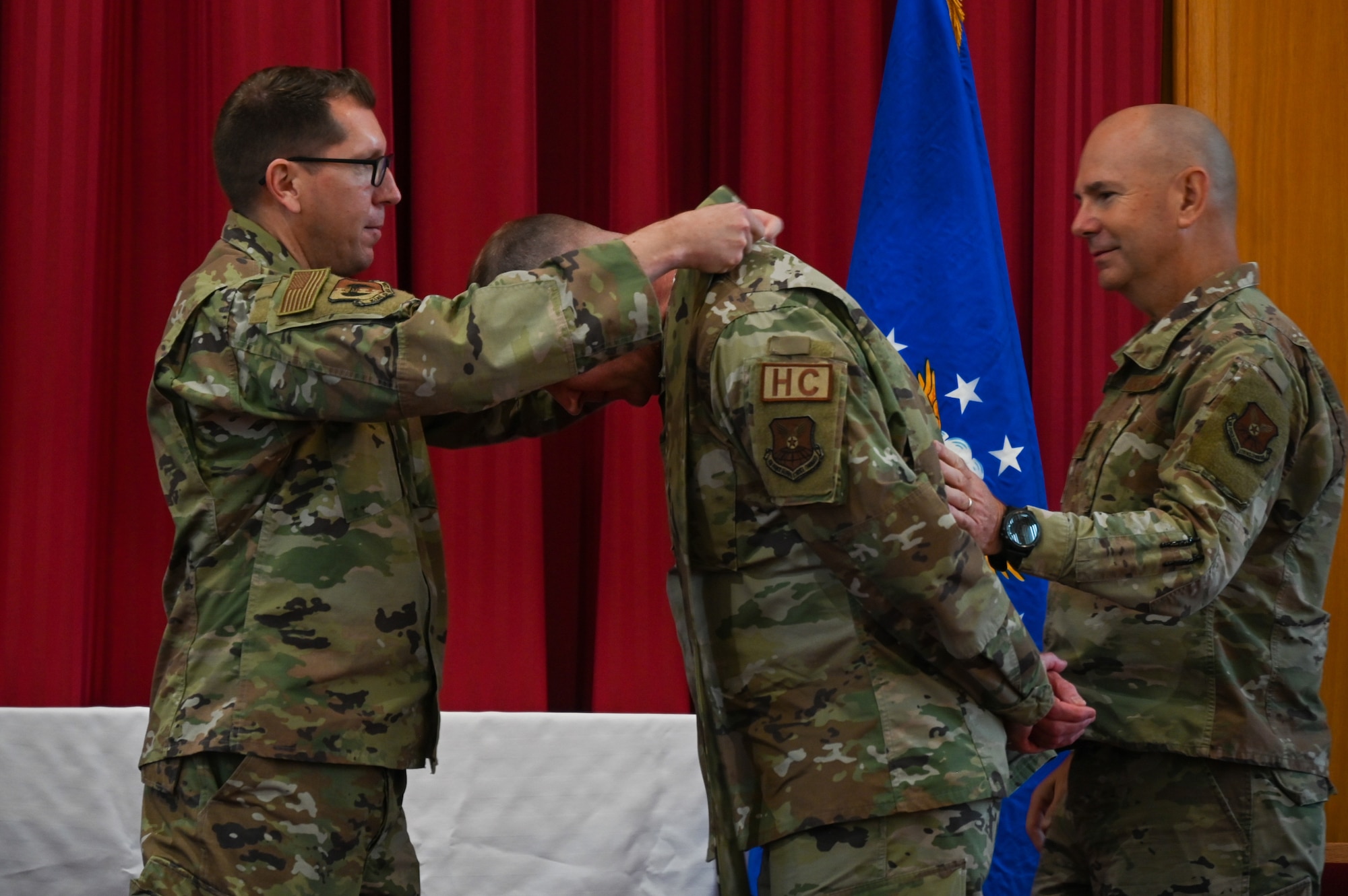 Chaplain Lt. Col. Dallas Little is anointed as Wing Chaplain by Col. Dan Hoadley, 5th Bomb Wing commander, and Global Strike Command Chaplain Col. David Kelley, at Minot Air Force Base, North Dakota, Sept. 13, 2022. The ceremony was the first ever conducted at Minot AFB and one of few ever Air Force wide. (U.S Air Force photo by Senior Airman Zachary Wright)