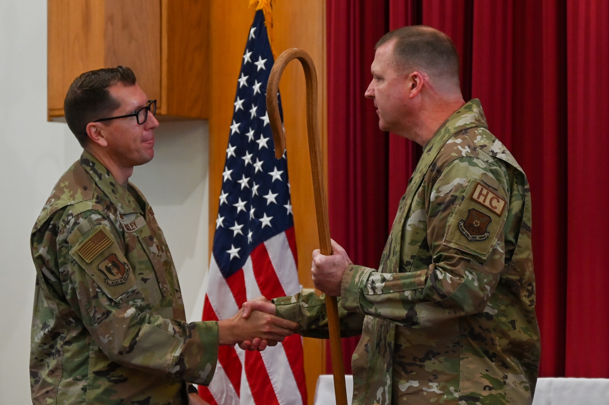 Chaplain Lt. Col. Dallas Little is anointed as Wing Chaplain by Col. Dan Hoadley, 5th Bomb Wing commander, and Global Strike Command Chaplain Col. David Kelley, at Minot Air Force Base, North Dakota, Sept. 13, 2022. The ceremony was the first ever conducted at Minot AFB and one of few ever Air Force wide. (U.S Air Force photo by Senior Airman Zachary Wright)