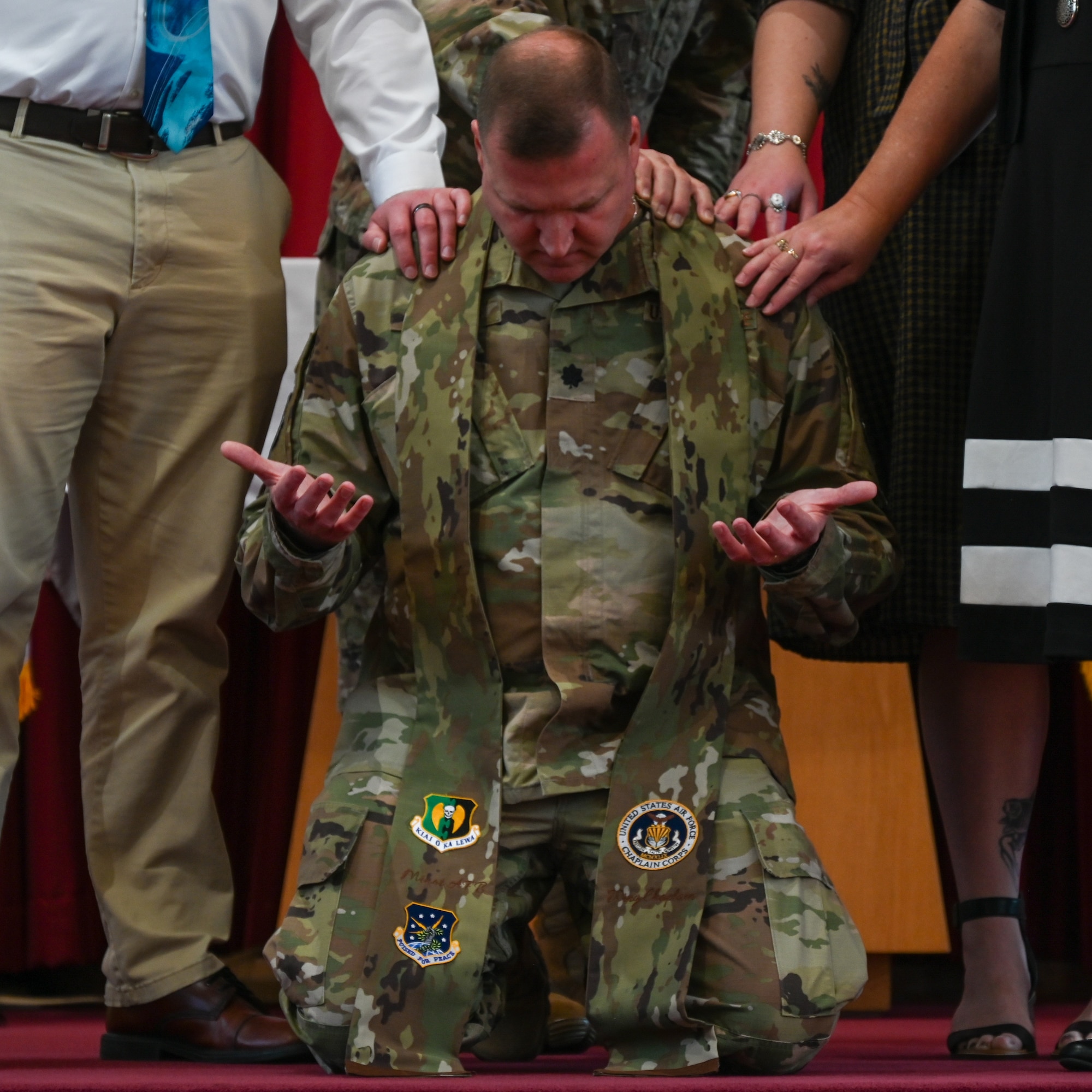 Chaplain Lt. Col. Dallas Little is anointed as Wing Chaplain by Col. Dan Hoadley, 5th Bomb Wing commander, and Global Strike Command Chaplain Col. David Kelley, at Minot Air Force Base, North Dakota, Sept. 13, 2022. The ceremony was the first ever conducted at Minot AFB and one of few ever Air Force wide. (U.S Air Force photo by Senior Airman Zachary Wright)
