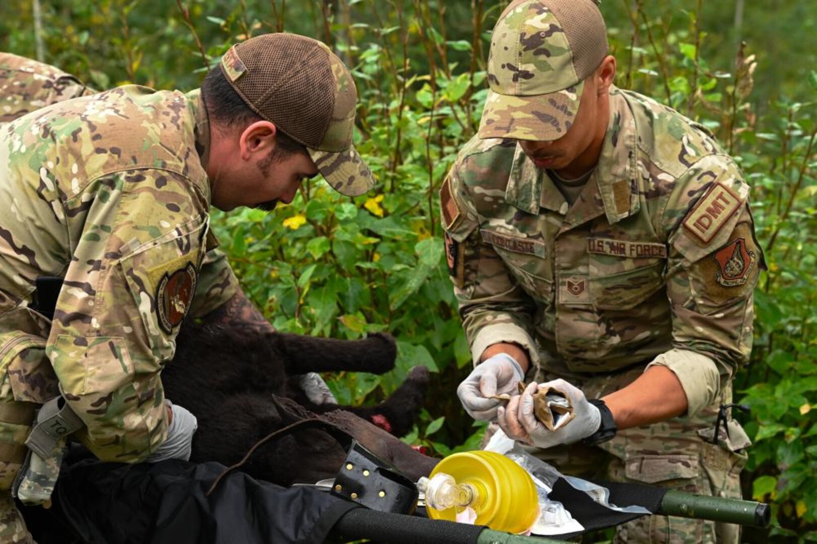 two soldiers participating in a mock dire K-9 rescue