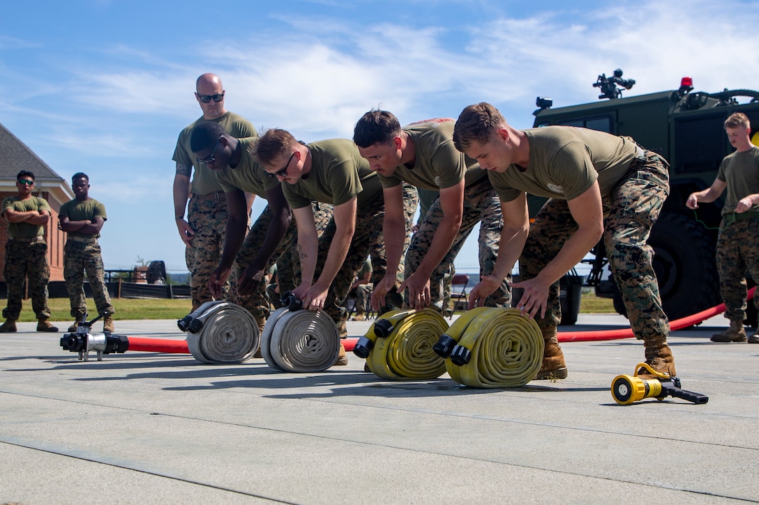 U.S. Marines with Marine Corps Air Facility Quantico and Chemical Biological Incident Response Force from Indian Head, Maryland participate in the Hose Drill Race for the Aircraft Rescue and Fire Fighter Rodeo at MCAF on Marine Corps Base Quantico, Sep. 2, 2022. The ARFF Rodeo is a competition for Marines to showcase their operational knowledge of firefighting tactics, techniques, and procedures.

(U.S. Marine Corps Photo by Lance Cpl. George Nudo)