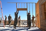 U.S. Air Force Airmen assigned to the 169th Civil Engineering Squadron, South Carolina Air National Guard, use construction tools to help build a community center for Blackfeet Nation Native Americans at Heart Butte, Montana, Sept. 6, 2022. The temporary deployment is part of the squadron’s yearly Innovative Readiness Training.
