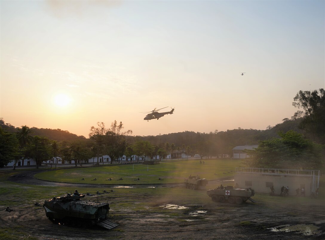 Marines from six separate nations to include Brazil, Dominican Republic, Ecuador, Jamaica, Paraguay, and the United States of America, provided a multinational amphibious raid demonstration for the U.S. Secretary of the Navy Carlos Del Toro, during his visit to Ilha do Governador, Rio de Janeiro, following the opening ceremony of exercise UNITAS LXIII, Sept. 8, 2022. UNITAS is the world's longest-running annual multinational maritime exercise that brings together forces from 19 countries to include Brazil, Cameroon, Chile, Colombia, Dominican Republic, Ecuador, France, Guyana, Jamaica, Mexico, Namibia, Panama, Paraguay, Peru, South Korea, Spain, United Kingdom, Uruguay, and the USA. The exercise focuses on enhancing interoperability among multiple nations and joint forces during littoral and amphibious operations in order to build on existing regional partnerships and create new enduring relationships that promote peace, stability, and prosperity in the U.S. Southern Command’s area of responsibility. (U.S. Marine Corps photo by Maj. Jeremy Wheeler)