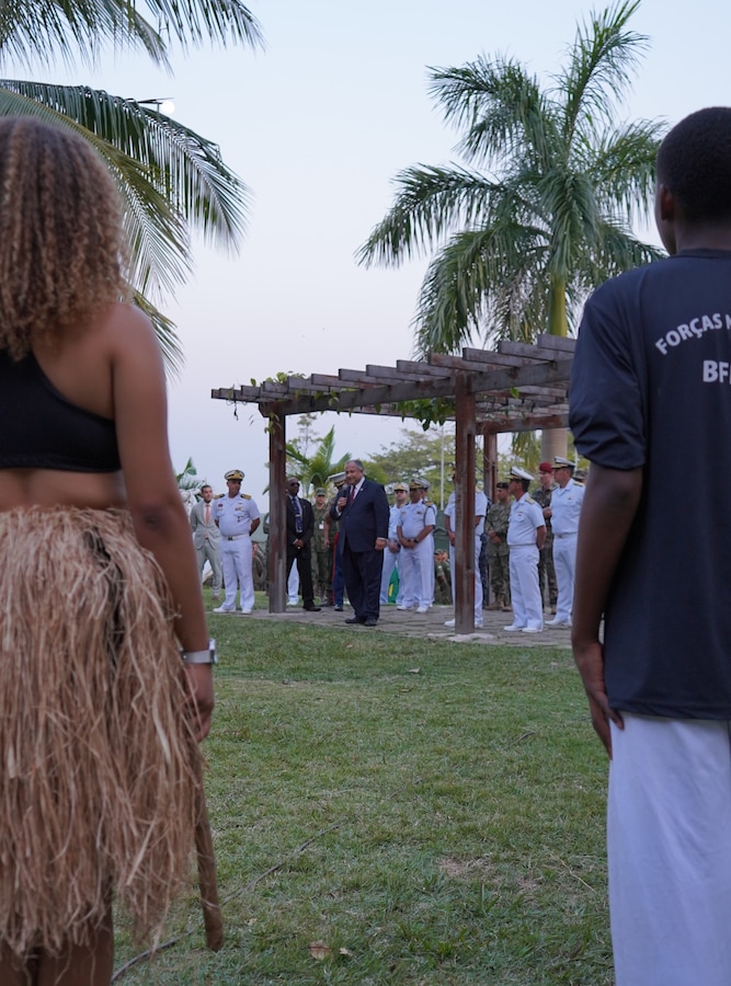 U.S. Secretary of the Navy Carlos Del Toro addresses a crowd of partner nations following a Brazilian cultural dance demonstration provided by Brazilian Forcas no Esporte (Forces in Sport) on the official opening day of exercise UNITAS LXIII at Ilha do Governador, Rio de Janeiro, Sept. 8, 2022. The Forcas no Esporte program aims to reduce the social risks of vulnerable young Brazilians and strengthen bonds of citizenship, inclusion, and social integration. The SECNAV shared his personal story regarding his humble upbringing from Cuba to the barrios of New York City. “If you apply yourself, if you study, if you work hard, your dreams can come true… and whatever you do, do it with passion so you can achieve your dreams.” UNITAS is the world’s longest-running annual multinational maritime exercise that focuses on enhancing interoperability among multiple nations and joint forces during littoral and amphibious operations in order to build on existing regional partnerships and create new enduring relationships that promote peace, stability, and prosperity in the U.S. Southern Command’s area of responsibility. (U.S. Marine Corps photo by Maj. Jeremy Wheeler)