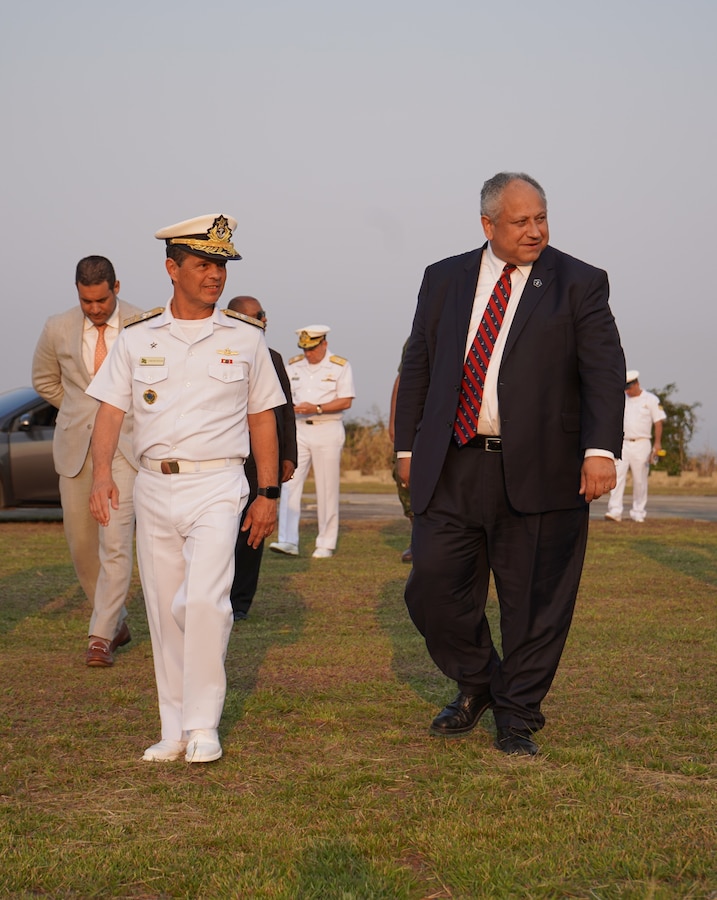 Vice-Almirante Chagas Vianna Braga (Vice Admiral Brazilian Marine Corps), left, Brazilian fleet marine force commander, escorts U.S. Secretary of the Navy Carlos Del Toro, right, to the reviewing stand to observe a multinational amphibious assault demonstration at Ilha do Governador, Rio de Janeiro, on the official opening day of UNITAS LXIII, Sept. 8, 2022. For the last 63 year, UNITAS has developed and sustained relationships that improve the capacity of our reemerging and enduring maritime partners to achieve common objectives. Additionally, the military-to-military exchanges foster friendly, mutual cooperation and understanding among participating navies and marine corps. (U.S. Marine Corps photo by Maj. Jeremy Wheeler)