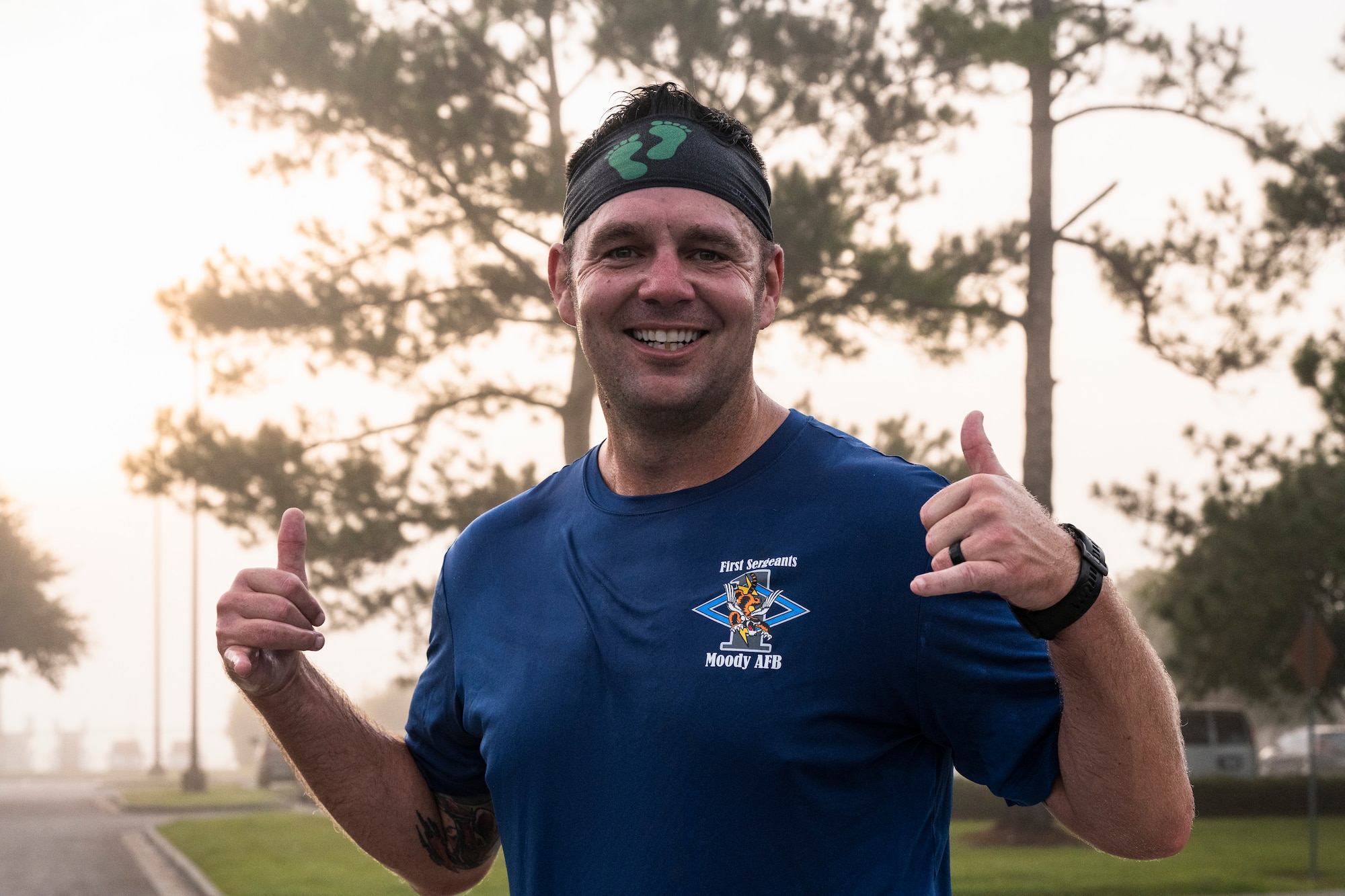 Airman poses for a photo after participating in a 9/11 remembrance run.