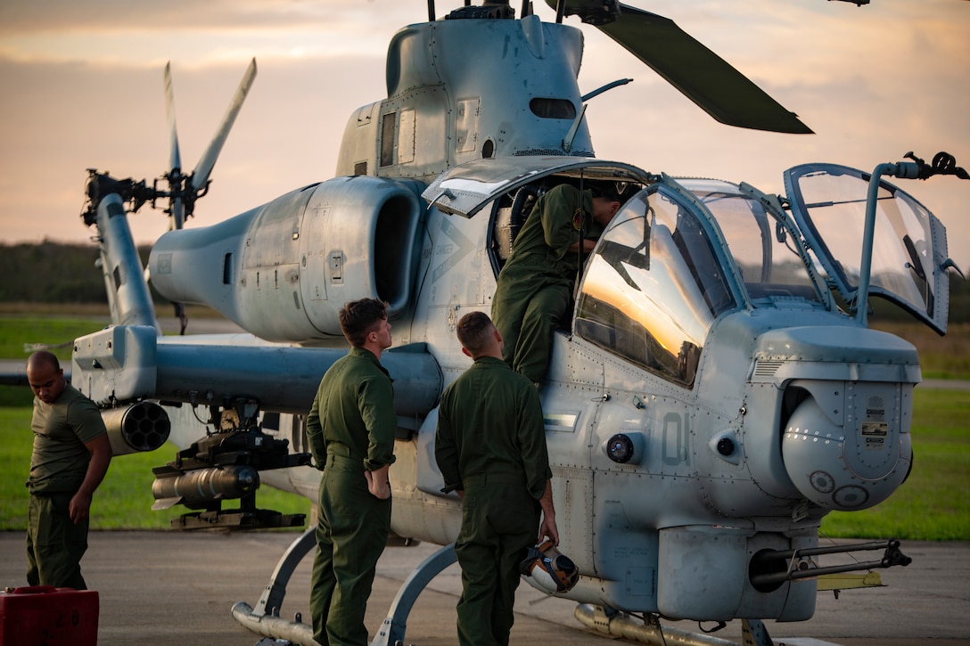 U.S. Marines with Marine Light Attack Helicopter Squadron - 773, 4th Marine Aircraft Wing, Marine Forces Reserve in support of Special Purpose Marine Air-Ground Task Force UNITAS LXIII, conduct routine maintenance on an AH-1Z Viper at São Pedro da Aldeia, Brazil, during exercise UNITAS LXIII, Sept. 7, 2022. UNITAS is the world's longest-running annual multinational maritime exercise that focuses on enhancing interoperability among multiple nations and joint forces during littoral and amphibious operations in order to build on existing regional partnerships and create new enduring relationships that promote peace, stability, and prosperity in the U.S. Southern Command’s area of responsibility. (U.S. Marine Corps photo by 1st Lt. Mark L. Andries)