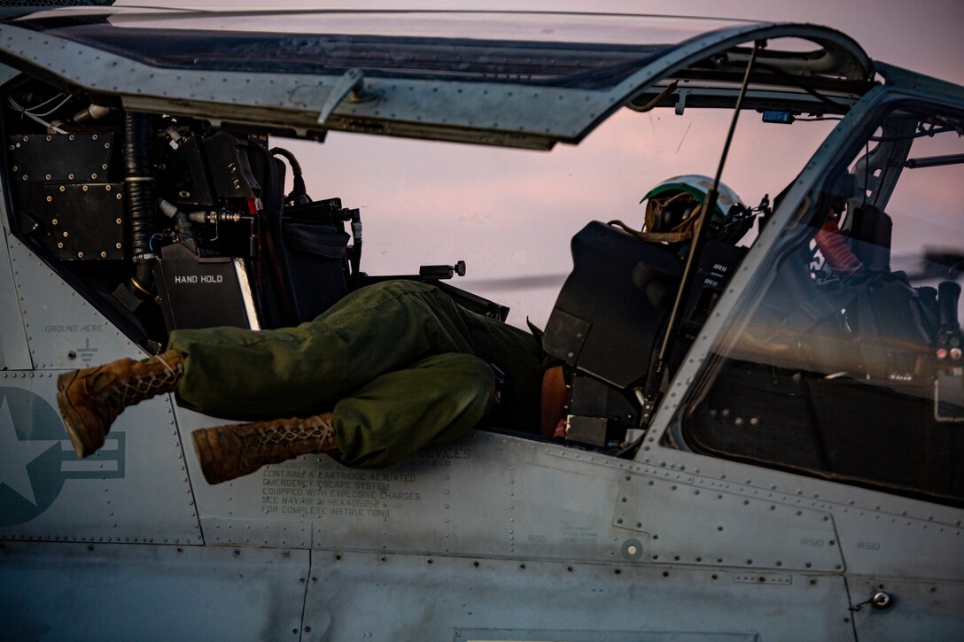 Cpl. Kevin Yoon, an avionics technician, with Marine Light Attack Helicopter Squadron - 773, 4th Marine Aircraft Wing, Marine Forces Reserve in support of Special Purpose Marine Air-Ground Task Force UNITAS LXIII, conducts routine maintenance on an AH-1Z Viper at São Pedro da Aldeia, Brazil, during exercise UNITAS LXIII, Sept. 7, 2022. UNITAS is the world's longest-running annual multinational maritime exercise that focuses on enhancing interoperability among multiple nations and joint forces during littoral and amphibious operations in order to build on existing regional partnerships and create new enduring relationships that promote peace, stability, and prosperity in the U.S. Southern Command’s area of responsibility. Yoon is a native of Sacramento, CA. (U.S. Marine Corps photo by 1st Lt. Mark L. Andries)