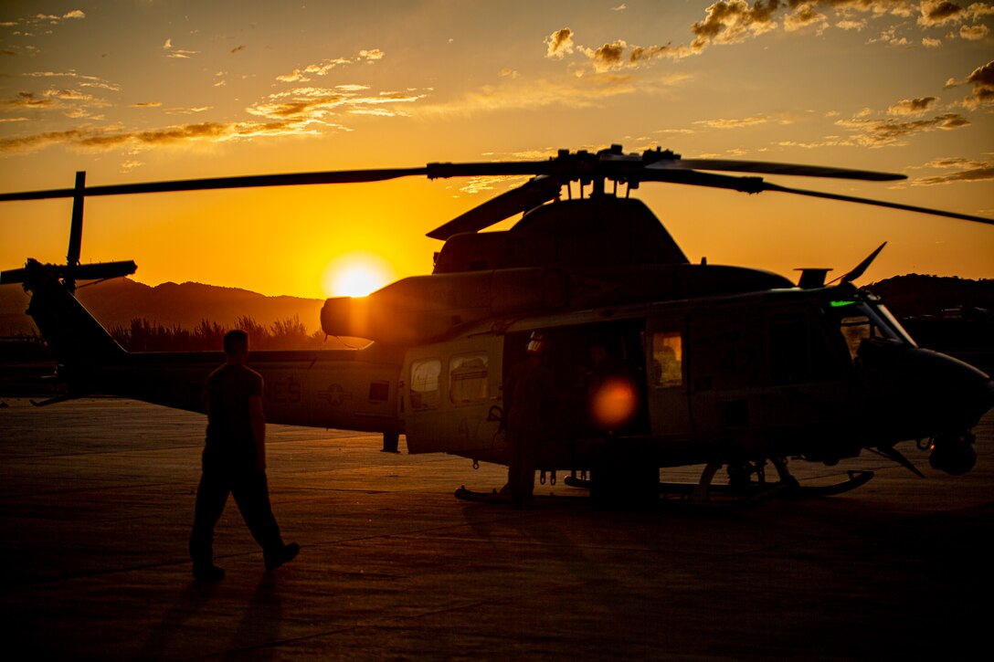 U.S. Marines with Marine Light Attack Helicopter Squadron - 773, 4th Marine Aircraft Wing, Marine Forces Reserve in support of Special Purpose Marine Air-Ground Task Force UNITAS LXIII, conduct routine maintenance on a UH-1Y Venom at São Pedro da Aldeia, Brazil, during exercise UNITAS LXIII, Sept. 7, 2022. UNITAS is the world's longest-running annual multinational maritime exercise that focuses on enhancing interoperability among multiple nations and joint forces during littoral and amphibious operations in order to build on existing regional partnerships and create new enduring relationships that promote peace, stability, and prosperity in the U.S. Southern Command’s area of responsibility. (U.S. Marine Corps photo by 1st Lt. Mark L. Andries)