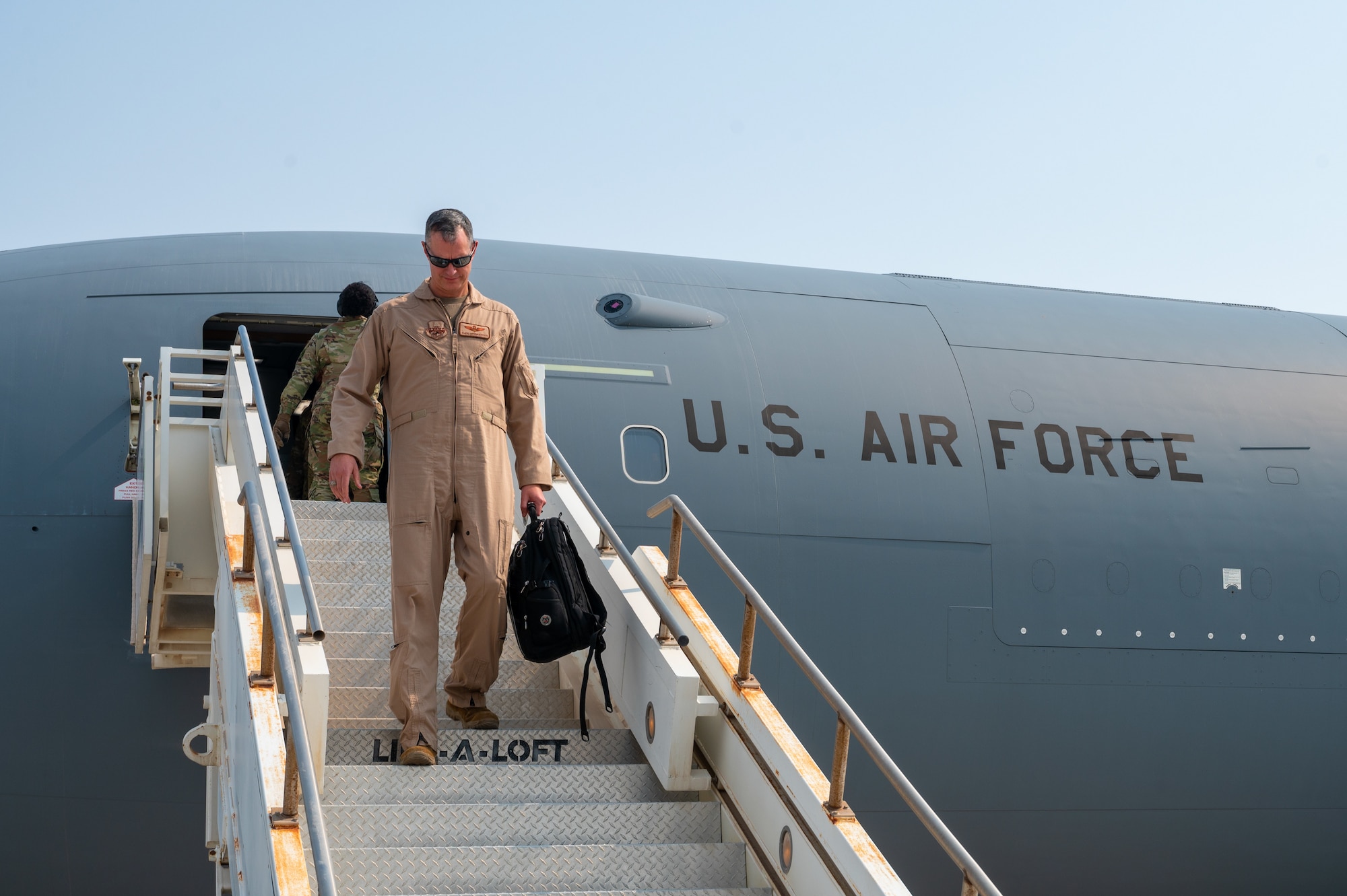 U.S. Air Force Lt. Gen. Alexus Grynkewich, Ninth Air Force commander and Combined Forces Air Component commander for U.S. Central Command, exits a KC-46A Pegasus Sept. 3, 2022, at Al Udeid Air Base, Qatar.