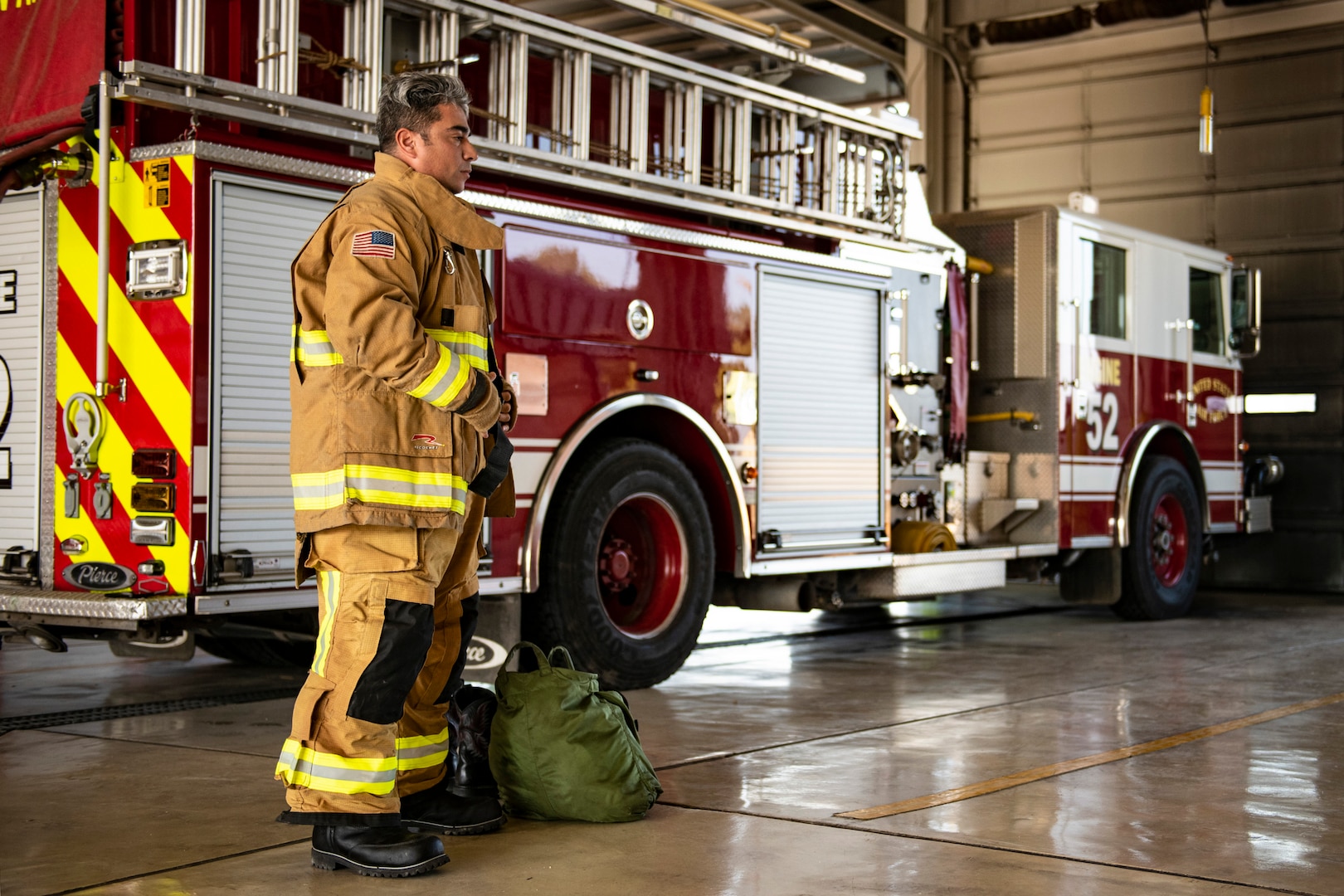 Rene Hinojosa, 902nd Civil Engineer Squadron firefighter, prepares to respond to an emergency response egress exercise for an F-16 Fighting Falcon at Joint Base San Antonio- Lackland Aug. 19, 2022.