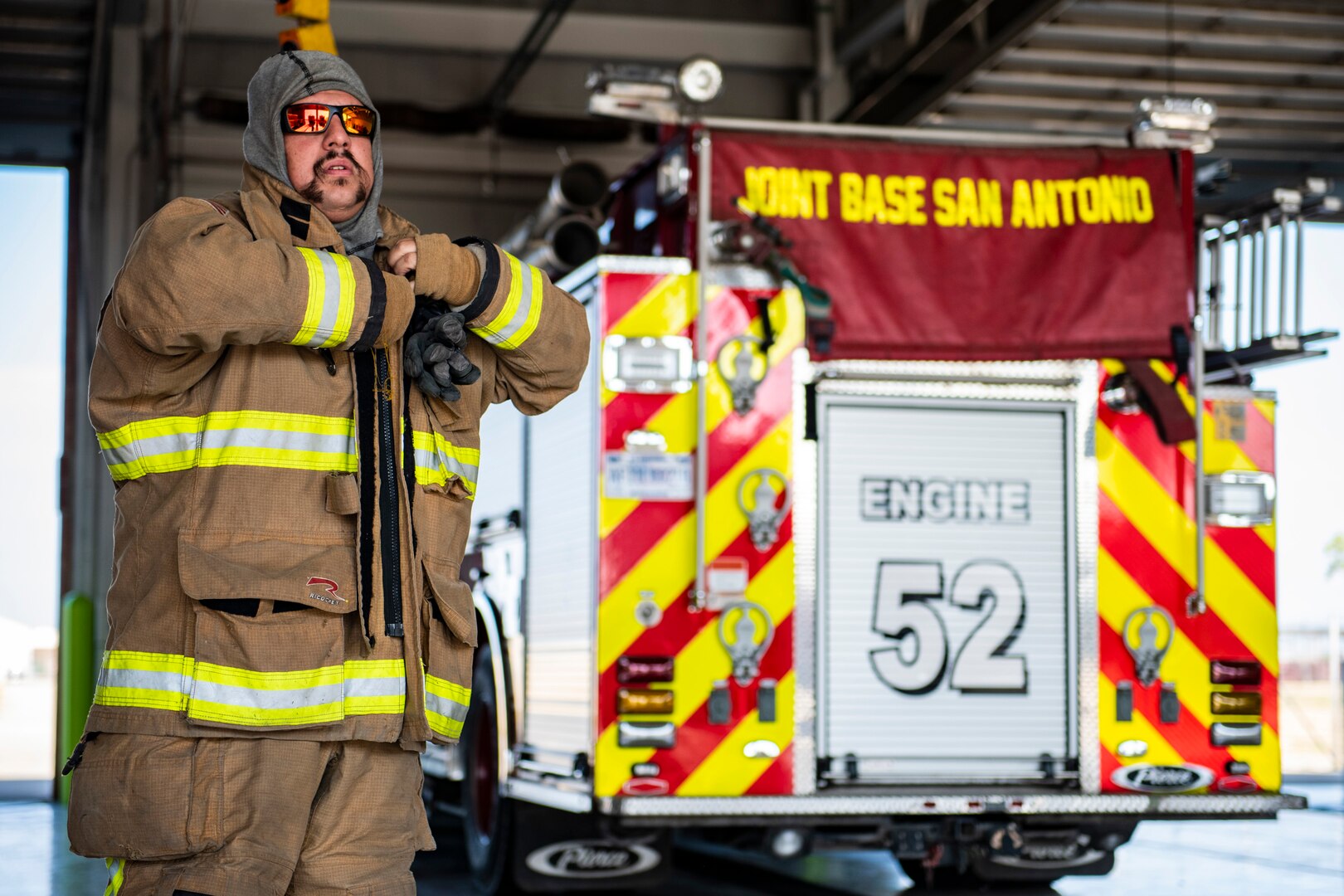 Andrew Sanchez, 902nd Civil Engineer Squadron lead firefighter, prepares to respond to an emergency response egress exercise for an F-16 Fighting Falcon at Joint Base San Antonio-Lackland, Aug. 19, 2022.