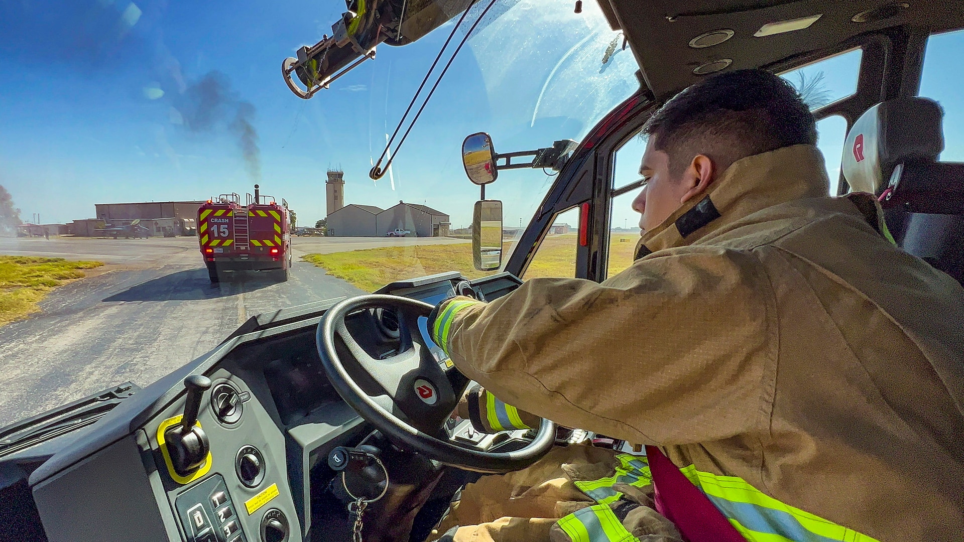 Abel Saldivar, 902nd Civil Engineer Squadron firefighter, responds to an emergency response egress exercise for an F-16 Fighting Falcon at Joint Base San Antonio-Lackland, Texas, Aug. 19, 2022.