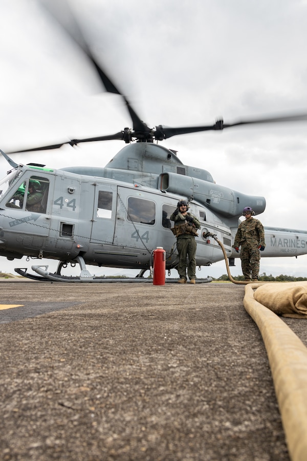 U.S. Marines with Marine Light Attack Helicopter Squadron (HMLA) 773, 4th Marine Aircraft Wing, Marine Forces Reserve, in support of Special Purpose Marine Air-Ground Task Force UNITAS LXIII, conduct a forward arming and refueling point operation as part of exercise UNITAS LXII at Santa Cruz Air Force Base, Rio de Janeiro, Sept. 5, 2022. UNITAS trains forces to conduct joint maritime operations through the execution of anti-surface, anti-submarine, anti-air, amphibious and electronic warfare operations that enhance warfighting proficiency and increase interoperability among participating naval and marine forces. (U.S. Marine Corps photo by Cpl. Jonathan L. Gonzalez)