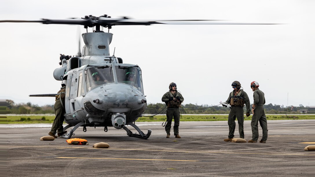 U.S. Marines with Marine Light Attack Helicopter Squadron (HMLA) 773, 4th Marine Aircraft Wing, Marine Forces Reserve, in support of Special Purpose Marine Air-Ground Task Force UNITAS LXIII, conduct a forward arming and refueling point operation as part of exercise UNITAS LXIII at Santa Cruz Air Force Base, Rio de Janeiro, Sept. 5, 2022. UNITAS develops and sustains relationships that improve the capacity of our reemerging and enduring maritime partners to achieve common objectives. Additionally, the military-to-military exchanges foster friendly, mutual cooperation and understanding among participating navies and marine corps. (U.S. Marine Corps photo by Cpl. Jonathan L. Gonzalez)