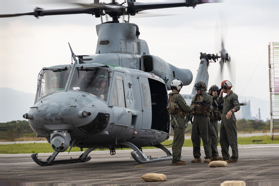 U.S. Marines with Marine Light Attack Helicopter Squadron (HMLA) 773, 4th Marine Aircraft Wing, Marine Forces Reserve, in support of Special Purpose Marine Air-Ground Task Force UNITAS LXIII, conduct a forward arming and refueling point operation as part of exercise UNITAS LXIII at Santa Cruz Air Force Base, Rio de Janeiro, Sept. 5, 2022. UNITAS is the world's longest-running annual multinational maritime exercise that focuses on enhancing interoperability among multiple nations and joint forces during littoral and amphibious operations in order to build on existing regional partnerships and create new enduring relationships that promote peace, stability and prosperity in the U.S. Southern Command’s area of responsibility. (U.S. Marine Corps photo by Cpl. Jonathan L. Gonzalez)