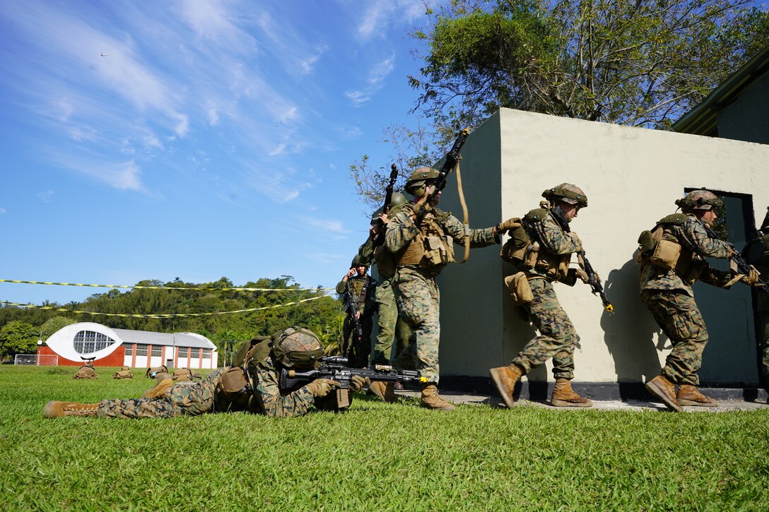 Marines from Lima Company, 3rd Battalion, 25th Marine Regiment, 4th Marine Division, Marine Forces Reserve in support of Special Purpose Marine Air-Ground Task Force UNITAS LXIII, conduct Military Operations in Urban Terrain (MOUT) training with Brazilian Marines at Ilha do Governador, Rio de Janeiro, Sept. 7, 2022. The training phase of exercise UNITAS integrates partner nations in various military events to exchange information on best practices and enhance interoperability of the multinational force. For the last 63 years, UNITAS has developed and sustained relationships that improve the capacity of our reemerging and enduring maritime partners to achieve common objectives. Additionally, the military-to-military exchanges foster mutual cooperation and understanding among participating navies and marine corps. (U.S. Marine Corps photo by Maj. Jeremy Wheeler)