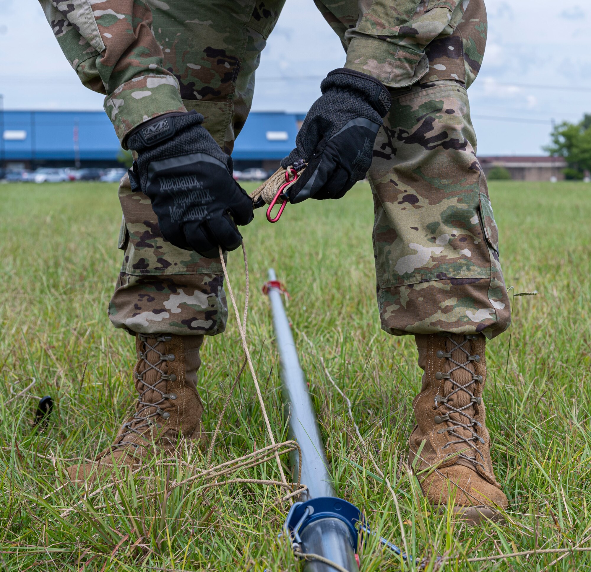 Airman 1st Class Diego Esparza, 4th Communications Squadron radio frequency transmission technician, connects hooks to a tactical mass-communication antenna during Exercise Agile Cub 22 at Seymour Johnson Air Force Base, North Carolina, August 25, 2022. The 4th CS’s mission is to ensure effective transmissions and radio frequencies to other bases, units and partners. (U.S. Air Force photo by Airman 1st Class Sabrina Fuller)