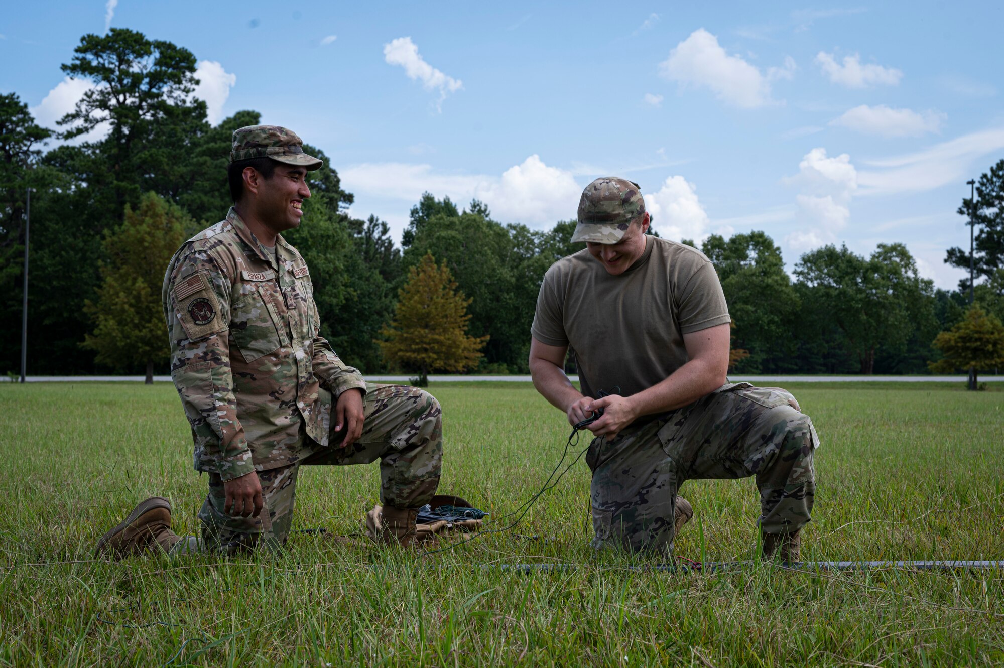 Senior Airman Brendon Rush and Airman 1st Class Diego Esparza, 4th Communications Squadron radio frequency transmission technicians, assemble a tactical mass-communication antenna during Exercise Agile Cub 22 at Seymour Johnson Air Force Base, North Carolina, August 25, 2022. Agile Cub trains Airmen to integrate with other squadrons, support airpower capabilities and deliver premier specialty training. (U.S. Air Force photo by Airman 1st Class Sabrina Fuller)