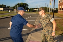 North American Aerospace Defense Command and U.S. Northern Command Deputy Operations Officer and Exercise Director, Coast Guard Rear Adm. Sean Regan, is greeted by U.S. Marine Corps Lt. Col. Christopher Grasso, Joint Task Force Civil Support Operations Officer, during a visit to JTF-CS headquarters on Ft. Eustis, Virginia, Sept. 14, 2022.