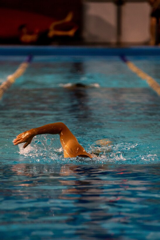 A U.S. Marine with 2d Marine Division conducts a 500-meter swim during the Division Leader Assessment Program 4-22 on Camp Lejeune, North Carolina, Sept. 8, 2022. The assessment program provides Marines with learning and mentorship opportunities, which helps train and develop Marines that demonstrate an apex level of lethality, endurance and comprehensive warfighting ability. (U.S. Marine Corps photo by Lance Cpl. Ryan Ramsammy)