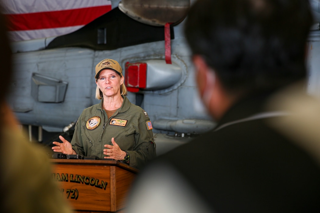 Capt. Amy Bauernschmidt, commanding officer of USS Abraham Lincoln (CVN 72), answers questions from Republic of Korea news media during a press conference aboard Abraham Lincoln during Rim of the Pacific (RIMPAC) 2022.