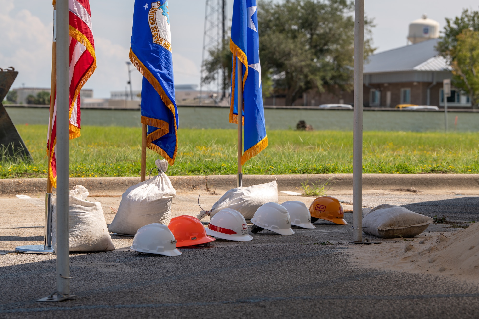 Hard hats lay on ground during ceremony