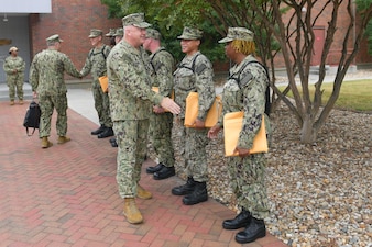 Master Chief Petty Officer of the Navy (MCPON) James Honea congratulates Commander, Naval Surface Force Atlantic (CNSL) staff chief petty officer selectees, at CNSL headquarters.