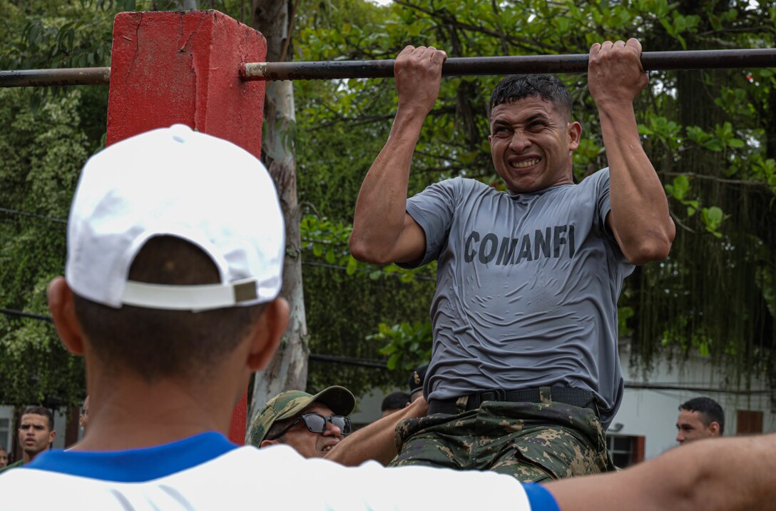 A Paraguayan Marine conducts pull ups during a ‘Marine of Steel’ event in Ilha do Governador, Rio de Janeiro, at a sports day event during exercise UNITAS LXIII, Sept. 4, 2022. UNITAS is the world’s longest-running annual multinational maritime exercise that focuses on enhancing interoperability among multiple nations and joint forces during littoral and amphibious operations in order to build on existing regional partnerships and create new enduring relationships that promote peace, stability and prosperity in the U.S. Southern Command’s area of responsibility. (U.S. Marine Corps photo by Lance Cpl Trystan Taft)