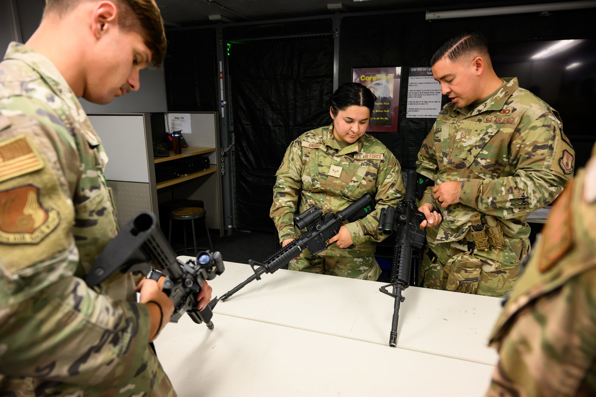 Right, Tech. Sgt. Christopher Baca, 75th Security Forces Squadron, instructs Airman 1st Class Angela Ambriz, 75th Air Base Wing, in weapons handling during an Ability to Survive and Operate rodeo (ATSO) at Hill Air Force Base, Utah, Sept. 13, 2022.
